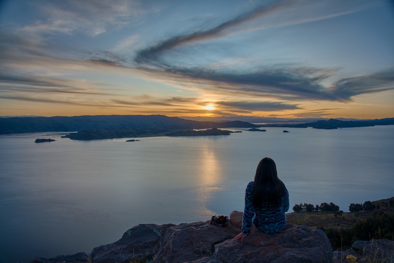 Nestled in the heart of Lake Titicaca, Amantani Island is a hidden gem. This serene island is known for its rich cultural heritage and breathtaking landscapes. Visitors are drawn to its spiritual traditions, particularly those of Pachamama and Pachatata. Pachamama, meaning "Mother Earth," and Pachatata, or "Father Earth," are central to the island's spiritual life. These traditions reflect the deep connection between the island's inhabitants and the natural world. The annual festival celebrating these deities is a vibrant display of Andean culture. Amantani's community is primarily of Quechua descent, preserving ancient customs and languages. The island's isolation has helped maintain its traditional way of life. This offers visitors a unique glimpse into the past. Travelers can immerse themselves in local culture through homestays with welcoming families. These experiences provide insight into daily life on the island. The island's car-free environment ensures a peaceful retreat. Hiking trails lead to the sacred temples of Pachamama and Pachatata. These sites offer panoramic views of Lake Titicaca. The island's natural beauty and cultural richness make it a must-visit destination. Sustainable tourism is encouraged to protect Amantani's unique environment and heritage. Visitors are urged to respect local customs and engage with the community. This ensures a meaningful and responsible travel experience. Amantani Island: A Sacred Gem on Lake Titicaca Amantani Island lies gracefully upon the world's highest navigable lake, Lake Titicaca. Known for its tranquil ambiance, it offers visitors a rare blend of natural splendor and cultural depth. The island hosts two prominent peaks, each with spiritual significance. Pachamama and Pachatata towers symbolize the deep-rooted Andean cosmology. Their names mean "Mother Earth" and "Father Earth" respectively, reflecting the community's harmonious relationship with nature. Amantani's Quechua-speaking inhabitants live in harmony with their environment. This harmonious way of life has been passed down through generations, preserving a rich cultural tapestry. Key features that make Amantani Island unique include: Cultural festivals showcasing traditional music and dance. Agricultural landscapes with terraced fields. Handmade crafts and textiles available for purchase. Life on the island is refreshingly simple, with a pace dictated by the sun and seasons. The absence of vehicles provides a perfect setting for a peaceful retreat. Amantani's community thrives on agriculture, with vibrant terraces painting the landscape. These terraces not only serve a utilitarian purpose but also stand as testaments to the islanders' resilience. The community's dedication to sustainable living ensures that Amantani's beauty remains untouched for future generations. The Spiritual Peaks: Pachamama and Pachatata Explained Amantani Island is crowned by two spiritual summits: Pachamama and Pachatata. These peaks hold profound significance for the local community, intertwining nature with their spiritual beliefs. The Pachamama peak stands as the highest point of the island. Revered as the embodiment of "Mother Earth," it symbolizes fertility, abundance, and the nurturing aspects of nature. The Pachamama temple atop is a sacred place for offerings and rituals. A short distance away, the Pachatata peak celebrates the masculine energy of "Father Earth." Here stands another temple, dedicated to balance and protection. This peak underscores the duality that is central to Andean belief systems. The climb to these peaks offers more than just stunning views. Visitors find themselves immersed in a landscape that is both physical and spiritual. Each step is a journey into the rich tapestry of Andean cosmology. Key features of Pachamama and Pachatata: Pachamama Peak: Highest point, maternal symbolism, fertility rites. Pachatata Peak: Second-highest, paternal energy, protection rituals. The connection between Pachamama and Pachatata embodies balance and duality. The Quechua believe in the interconnectedness of all things, mirrored in these sacred sites. For visitors, these peaks offer a chance to engage with a living tradition, breathing life into ancient beliefs. As you stand atop these summits, the vast expanse of Lake Titicaca unfolds before you, reiterating the enduring beauty and spiritual significance of Amantani. The Annual Pachamama and Pachatata Festival: Rituals and Revelry Each year, Amantani Island becomes the stage for a vibrant celebration, the Pachamama and Pachatata festival. This annual event draws both locals and curious travelers eager to witness ancient traditions come alive. The festival is a grand affair, symbolizing the unity of earth's nurturing and protective forces. It celebrates the harmonious interaction between Pachamama and Pachatata. Locals perform age-old rituals to honor these deities, ensuring good fortune and prosperity. As the festival begins, the island's community gathers in colorful attire. The atmosphere is charged with anticipation and reverence. Ceremonial rites involve offerings of coca leaves, grains, and flowers laid gently at the temples. These offerings are believed to appease the divine energies of the peaks. Dances and music form the heartbeat of the festival, resonating through the island. The rhythms of traditional instruments create an enchanting soundscape. The scene is alive with people moving in unison, paying homage to their heritage through dance. Visitors are welcome to participate, feeling the rhythm and energy of the community. The festival offers a genuine taste of Andean spirituality and camaraderie. An understanding of local customs becomes tangible as one shares in this cultural tapestry. Key festival highlights: Ritual Offerings: Traditional sacrifices of food and coca. Traditional Music: Instruments like charangos and flutes. Communal Dance: Symbolic movement reflecting unity and harmony. The celebration concludes with a shared meal, a gesture of communal unity. It's a feast where traditional Andean dishes invigorate the senses. This gathering marks the culmination of ceremonies, sealing the bonds of community and spirit. For travelers, witnessing the Pachamama and Pachatata festival is transformative. It provides insight into a world where heritage and spirituality are vibrant and alive. The experience fosters a deeper appreciation of Andean culture, leaving lasting impressions long after the festival ends. Andean Cosmology: The Deeper Meaning of Pachamama and Pachatata In the Andes, Pachamama and Pachatata are more than deities. They are profound elements of cosmology that reveal a harmonious worldview. Pachamama, or Mother Earth, embodies fertility and life-giving energy. She nurtures crops and sustains life, revered by the islanders as a benevolent, protective force. Pachatata, or Father Earth, complements Pachamama as a guardian and provider. He is the masculine force essential for balance, representing strength and stability. Together, they define the duality of nature, emphasizing interdependence and reciprocity. Their relationship is a cornerstone in Andean beliefs. The island's rituals reflect this cosmic connection, encouraging harmony with the environment. By recognizing these spiritual dimensions, the people of Amantani maintain a respectful kinship with nature. This relationship fosters sustainability, ensuring resources are used responsibly. For visitors, understanding these concepts enriches the Amantani experience. Observing the reverence for Pachamama and Pachatata offers a unique window into an ancient belief system. It invites a contemplation of one's own connection to nature, expanding perspectives through timeless wisdom. Homestays and Community Life: Immersing in Amantani’s Traditions Staying with a local family on Amantani Island is an unforgettable experience. It offers a unique glimpse into daily life and traditions. Visitors engage directly with islanders, sharing meals and stories. Homestays offer more than just a place to sleep; they provide a cultural exchange. Guests participate in daily activities like farming and cooking, fostering a deeper understanding of island life. This immersion creates lasting memories and mutual respect. Meals are a highlight, featuring authentic Andean cuisine made with fresh, local ingredients. From hearty soups to quinoa-based dishes, each meal is a culinary delight. The flavors offer a taste of regional heritage, deeply tied to the land. To maximize the homestay experience, consider engaging in community events. Whether it's a weaving demonstration or a musical evening, opportunities abound. These interactions enrich the journey, offering insights into traditional arts. Key experiences to consider during a homestay: Participating in agricultural activities Sharing traditional meals Engaging in cultural events Learning traditional crafts from artisans Exploring local customs and lifestyles By embracing the island's rhythm, travelers can fully appreciate the depth and richness of Amantani's culture. This approach encourages meaningful connections and an appreciation for this unique way of life. Hiking the Sacred Trails: Visiting the Temples of Pachamama and Pachatata Hiking on Amantani Island is a profound and spiritual experience. The trails lead explorers to the revered temples of Pachamama and Pachatata. These sacred peaks offer not only stunning views but also a deep sense of tranquility. The Pachamama temple, perched on the island's highest point, invites reflection. The trek offers panoramic vistas of Lake Titicaca, rewarding the effort with breathtaking beauty. It's a pilgrimage embraced by both locals and visitors. To reach Pachatata's temple, hikers traverse a path less steep but equally rewarding. This journey unveils insights into the island's spiritual duality, with both peaks embodying cosmic balance. The serene atmosphere enhances the meditative walk. Hiking these trails is not only about scenery but also a spiritual journey. The island's silence allows for introspection, providing an ideal setting for contemplation. It's a chance to connect with nature and oneself. To prepare for the hike: Wear sturdy footwear for uneven paths Carry water and snacks Dress in layers for changing weather Bring a camera for stunning landscapes Respect local customs and sacred sites Both trails highlight Amantani's unique blend of natural and spiritual beauty. They offer travelers a rare opportunity to connect with the island's profound cultural heritage. Sustainable Tourism and Responsible Travel on Amantani Amantani Island thrives on sustainable tourism. The community prioritizes preserving its pristine environment and cultural heritage. Visitors are encouraged to engage responsibly to ensure minimal impact. Sustainable practices include supporting local businesses. By choosing locally operated tours, travelers contribute directly to the island's economy. This approach promotes the community’s welfare and fosters cultural exchange. Respect for local customs is crucial. Visitors should approach spiritual sites with reverence. Participating in traditions with understanding enriches the travel experience and honors local beliefs. Travelers can adopt various practices to support sustainability: Opt for homestays to experience local life Purchase handmade crafts as authentic souvenirs Limit waste by using refillable water bottles Respect wildlife and natural surroundings Engage in cultural exchanges with sensitivity By embracing these principles, travelers leave a positive legacy. Sustainable tourism on Amantani is a shared responsibility, ensuring that future generations can enjoy its unique beauty and traditions. Practical Travel Tips: Getting to Amantani and What to Expect Reaching Amantani requires a scenic journey. Boats depart from Puno, taking travelers across Lake Titicaca. The ride offers stunning views, setting the stage for an enriching adventure. Weather on the island is often cool. Packing warm clothing is advisable, especially for evenings. Layering clothes helps manage varying temperatures throughout the day. Navigation on the island is by foot. Bring comfortable footwear for walking the stone pathways and trails. The island's car-free environment ensures a peaceful exploration. Visitors should prepare for the island's rustic charm. Accommodations often involve homestays, providing an authentic cultural experience. These stays offer insight into local life and hospitality. Consider these essentials for your visit: Passport and identification Currency in small denominations for local transactions Refillable water bottle to stay hydrated Sunscreen and hats for sun protection Camera or smartphone for capturing memories Understanding local customs enhances your journey. Engage with the Amantani community with respect and curiosity. This approach ensures a respectful and memorable visit to this magical island. Capturing the Spirit: Content Creation and Storytelling on Amantani Amantani Island is a storyteller's paradise. Its cultural richness and stunning landscapes offer numerous storytelling opportunities. Observing local customs can spark creative content. Consider the vibrant Pachamama and Pachatata festival. Capture moments of traditional dance and music. These expressions of Andean spirituality create compelling visual narratives. Focus on personal interactions during homestays. Conversations with locals provide deep insights into their daily lives. These stories resonate well with audiences seeking authentic travel experiences. Here are some storytelling ideas: Document daily life in a local village Highlight the symbolism of Pachamama and Pachatata rituals Capture the serene beauty of Lake Titicaca's views Content creators are encouraged to immerse themselves. Listen and learn from the island's narratives. Amantani's essence lies in its cultural depth and breathtaking scenery, inviting creators to share these wonders with the world. Curating Unique Itineraries: Advice for Travel Agents Crafting a memorable itinerary for Amantani requires understanding its cultural essence. Focus on integrating immersive experiences with the island's spiritual traditions. These elements create enriching journeys for travelers. Consider incorporating the Pachamama and Pachatata festivals into the itinerary. These events highlight the island's vibrant culture. The inclusion of these festivals can enhance travel experiences significantly. To enrich clients' adventures, consider these itinerary elements: Arrange homestay experiences with local families Include guided hikes to Pachamama and Pachatata temples Suggest purchasing handmade textiles as souvenirs By personalizing these elements, travel agents can offer extraordinary itineraries. This approach ensures clients gain deep cultural insights and appreciation for Amantani's unique traditions. Conclusion: The Enduring Legacy of Amantani’s Pachamama and Pachatata Amantani Island, with its Pachamama and Pachatata traditions, stands as a beacon of cultural preservation in the heart of Lake Titicaca. These spiritual practices offer a glimpse into the deep-rooted beliefs of the Andean people. They reflect an enduring commitment to honoring nature and harmony. Visitors to Amantani are not simply tourists but participants in a living tradition. The balance and connection between Pachamama and Pachatata serve as powerful reminders of humanity's ties to the earth. These ancient traditions continue to thrive, bringing communities together and enriching lives. The serene beauty and cultural vibrancy of Amantani create an atmosphere of introspection and appreciation. Every walk along its trails and conversation with its people contribute to a deeper understanding of the island’s spirit. For content creators, travel agents, and visitors, the island offers endless stories waiting to be shared. Amantani remains a testament to the resilience and sustainability of indigenous cultures. As travelers seek experiences beyond the ordinary, this sacred island continues to inspire with its profound spirituality and sense of community. It invites all who visit to carry its lessons of balance and reverence out into the world.